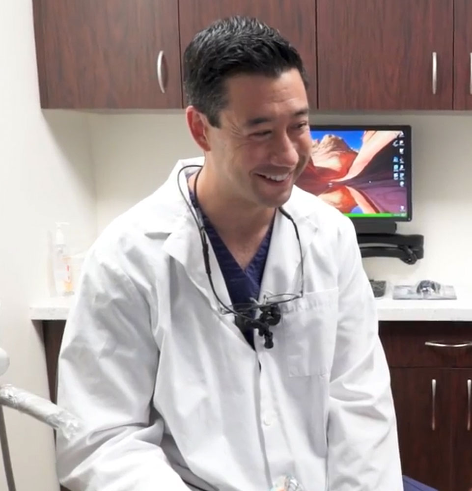 drferrier with implant patient discussing treatment